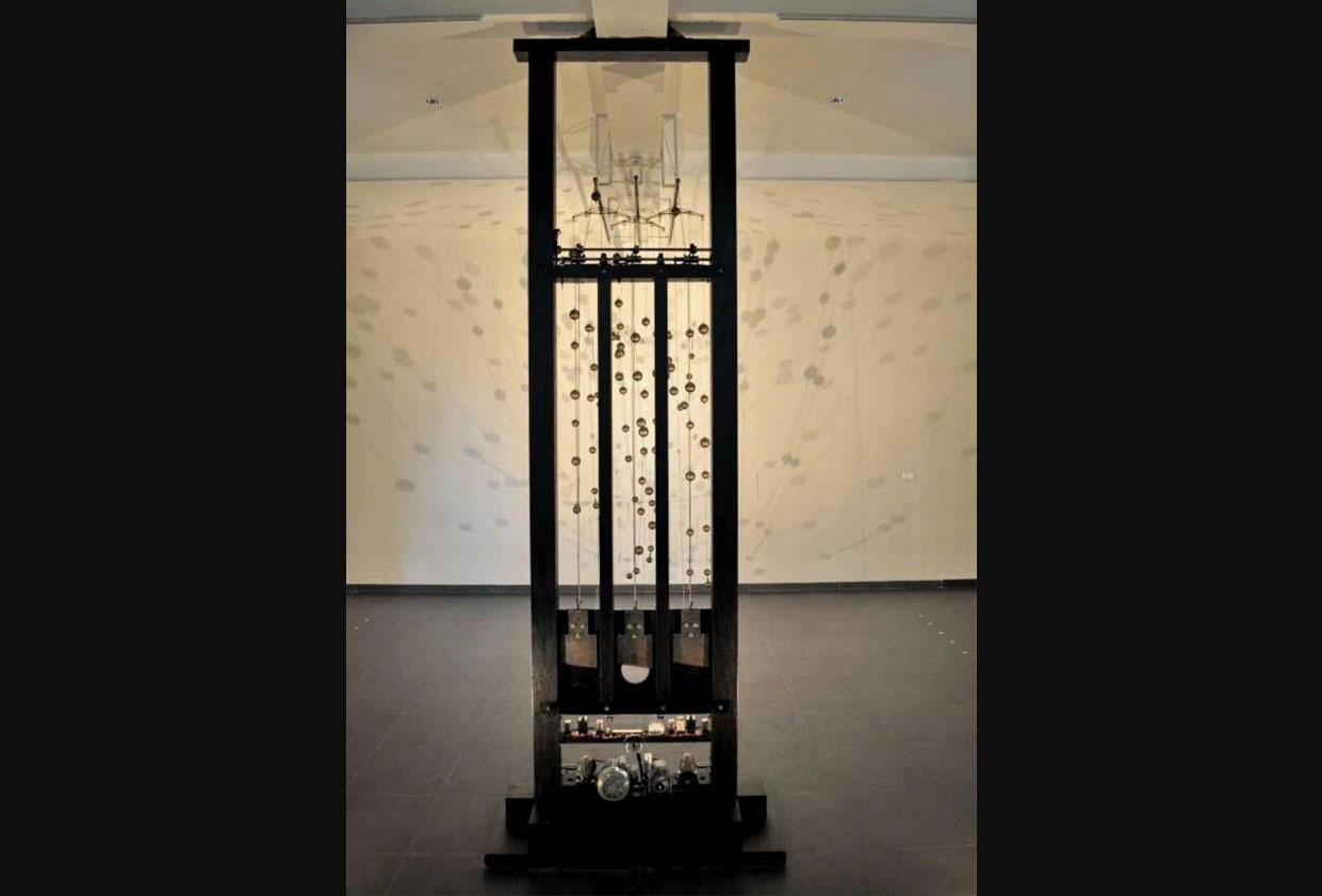 Lama Sabakhtani #01 by Ms. Ay Tjoe Christine (Indonesia). Medium/Material: Wood, metal, wire, brass balls. Ms Ay Tjoe Christine’s work is a replica of the guillotine in its actual size, following the model of a real guillotine. The structure of the object that generates the sound is created by installing three knives, with the movements controlled through two series of gears and two dynamos. Christine’s work shows very subtle visual ideas of violence and sadism, something that is usually portrayed in a more explicit way. Her work also reinterprets the idea of crucifixion, highlighted this almost forgotten issue in Indonesia’s contemporary art practice.