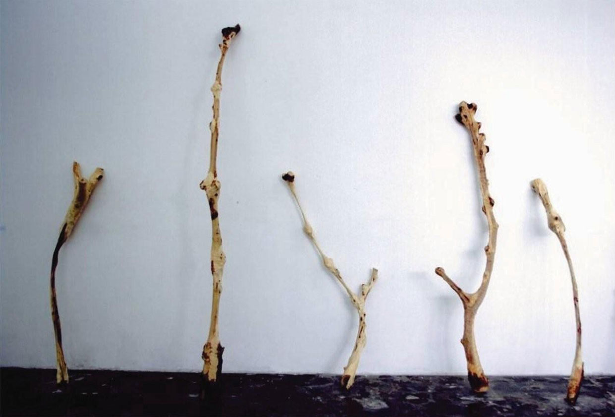 Thin | 瘦 by Mr. Yang Xinguang (China). Medium/Material: Wood. Chinese artist Yang Xinguang’s wooden sculptures depict a state of invasion and attack. In a single attempt, Yang axed and inflicted cuts on these pieces of wood in cruelty, presenting them like thin human bones.